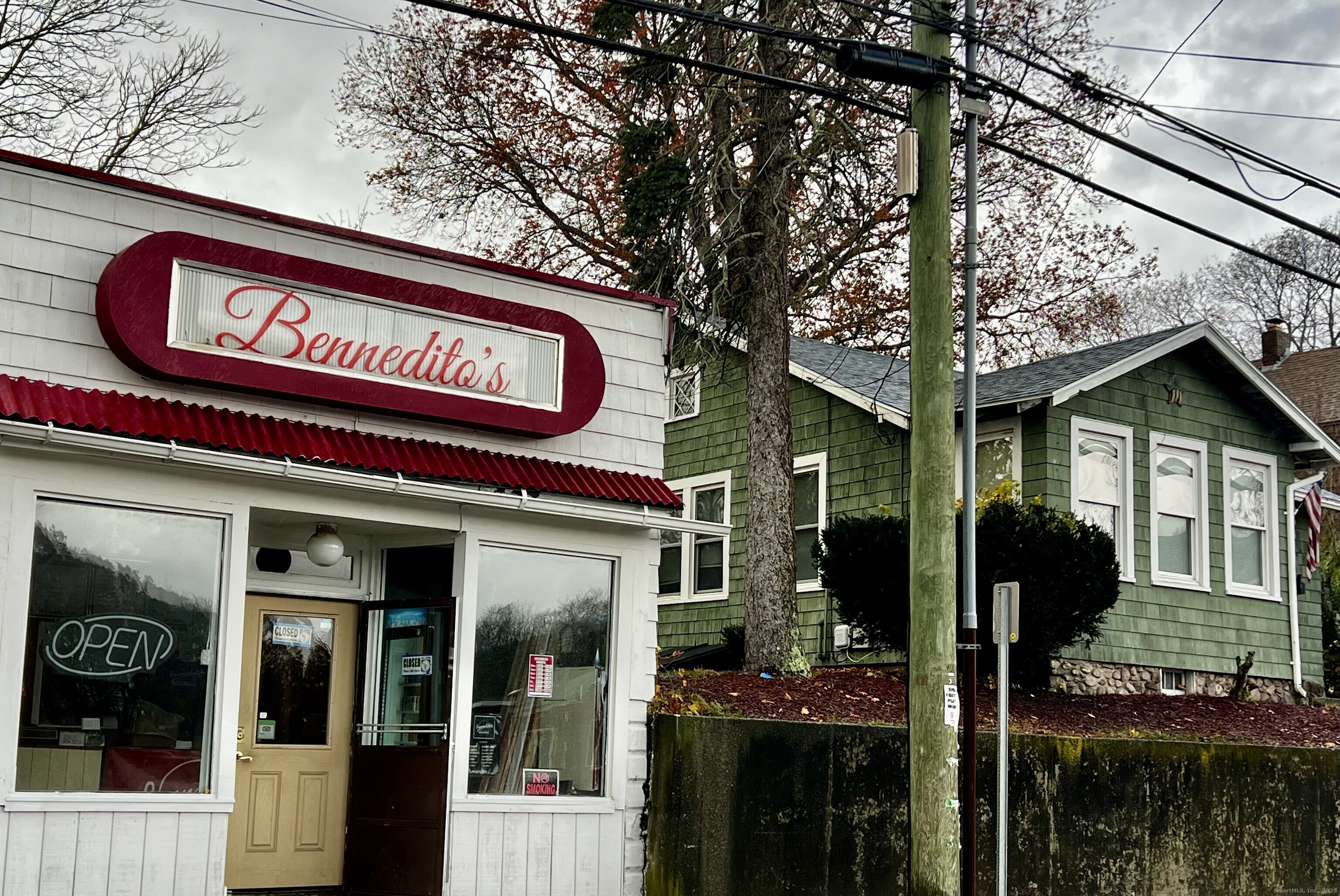 231 Poquonnock Road Groton, CT 06340 - Photo 18 of 23 a view of a building with retail shops and traffic signal