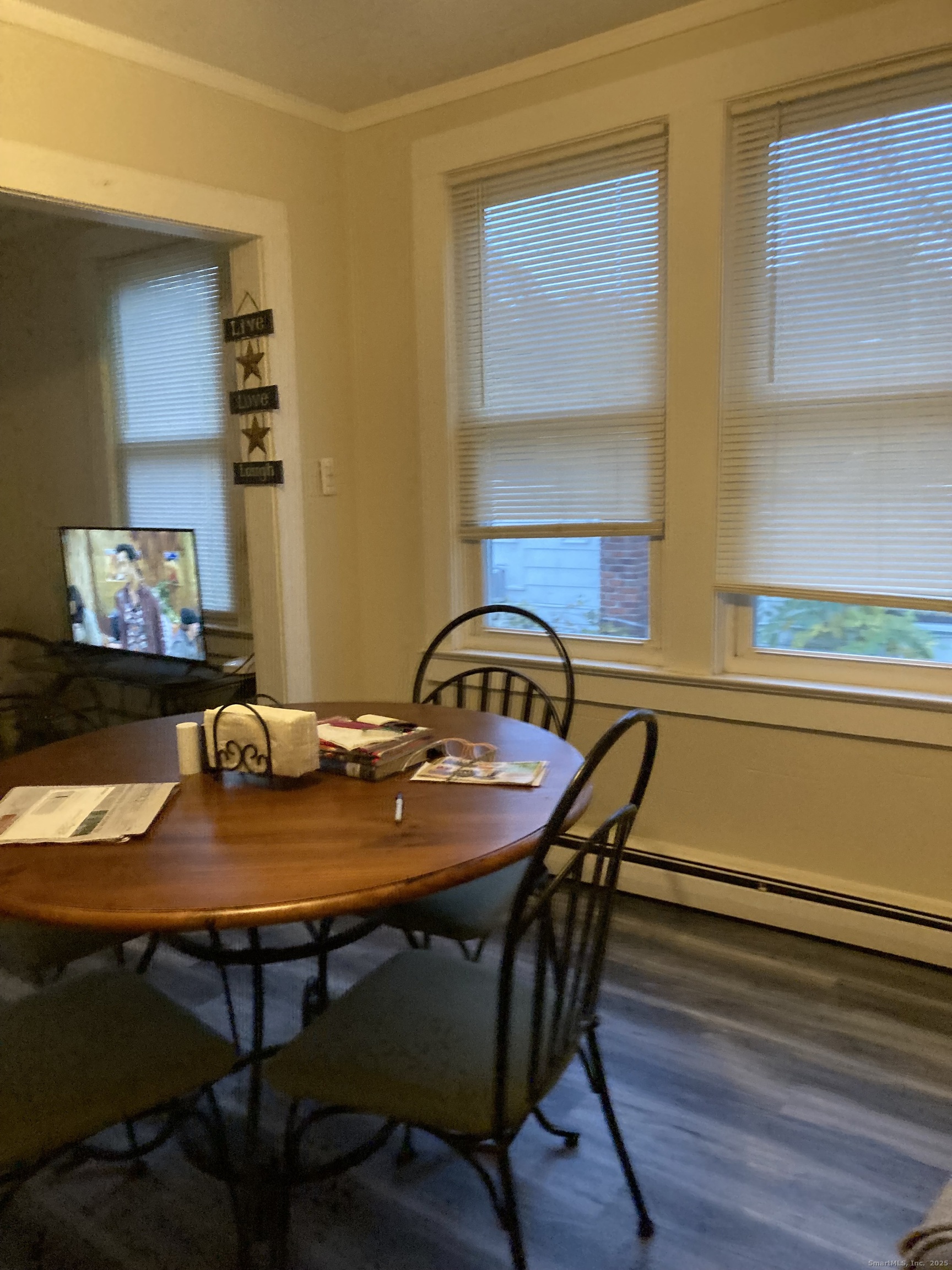 231 Poquonnock Road Groton, CT 06340 - Photo 6 of 23 a view of a dining room with furniture and wooden floor