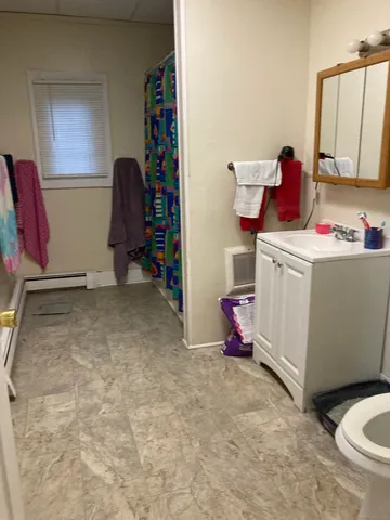 a room with furniture and a flat screen tv