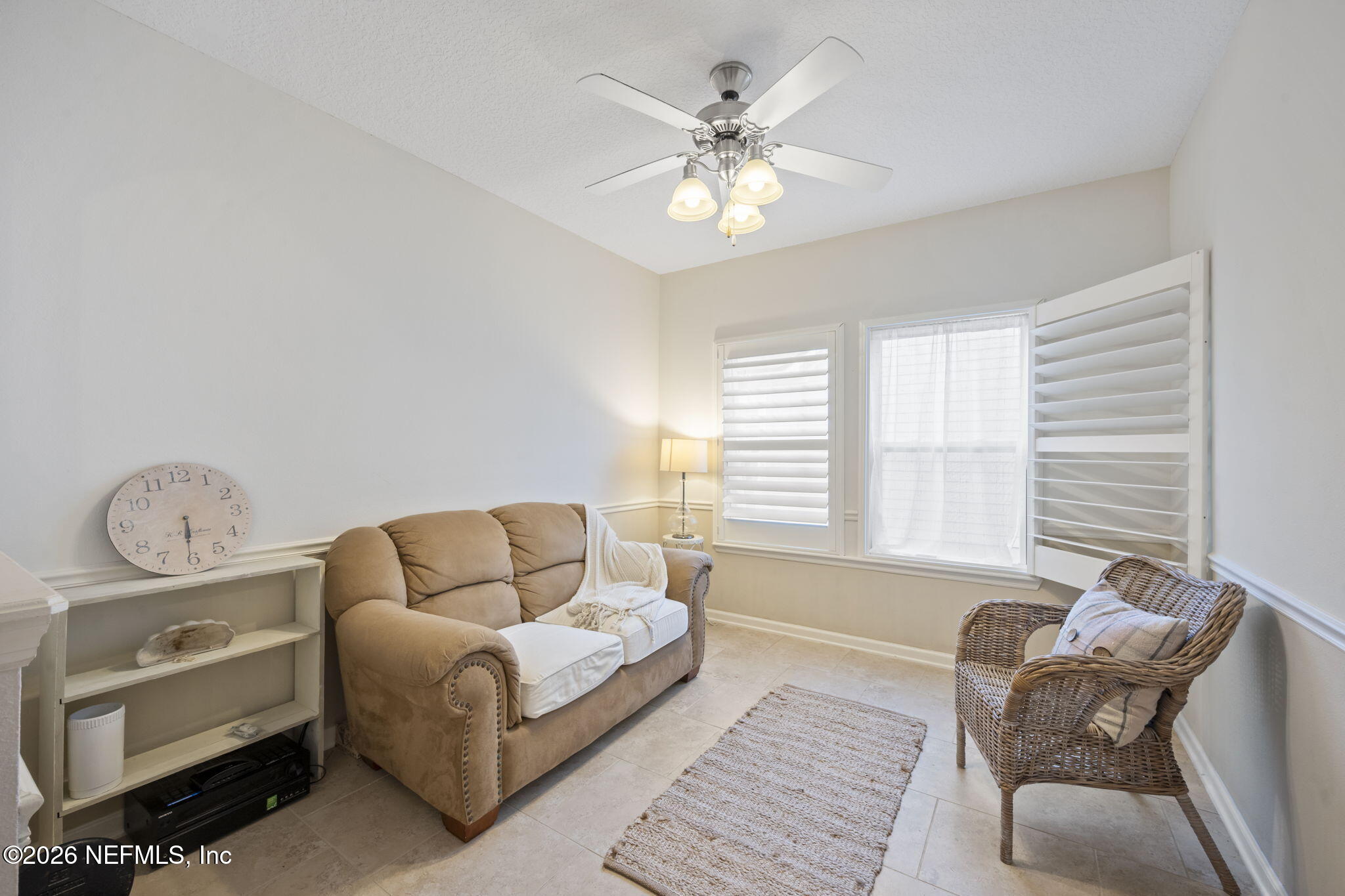 26 Olivette Street St. Johns, FL 32259 - Photo 14 of 42 a living room with furniture a chandelier fan and a window