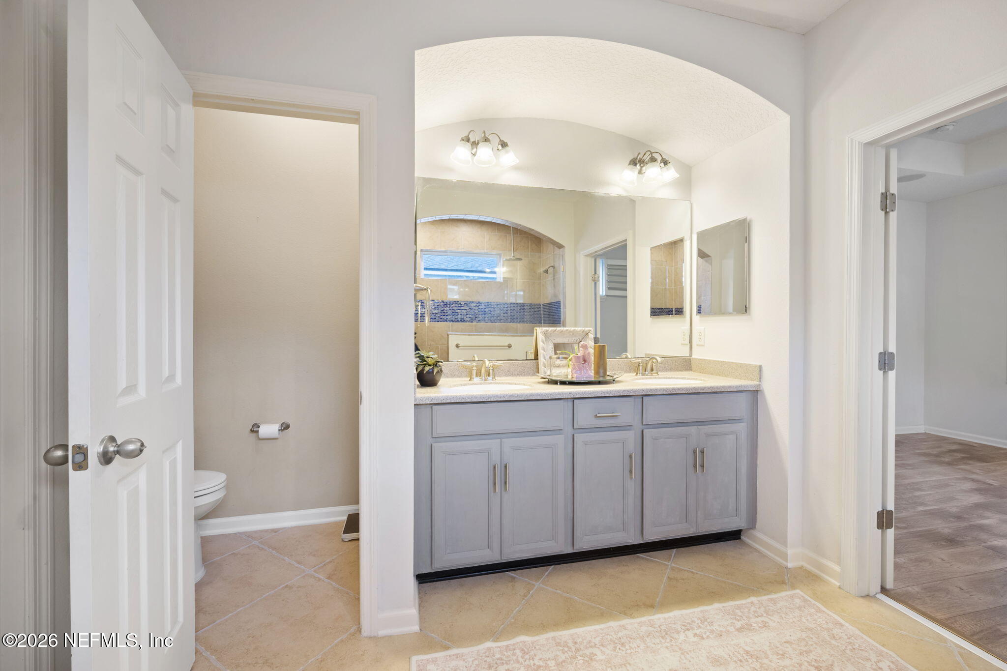 26 Olivette Street St. Johns, FL 32259 - Photo 17 of 42 a bathroom with a double vanity sink and mirror
