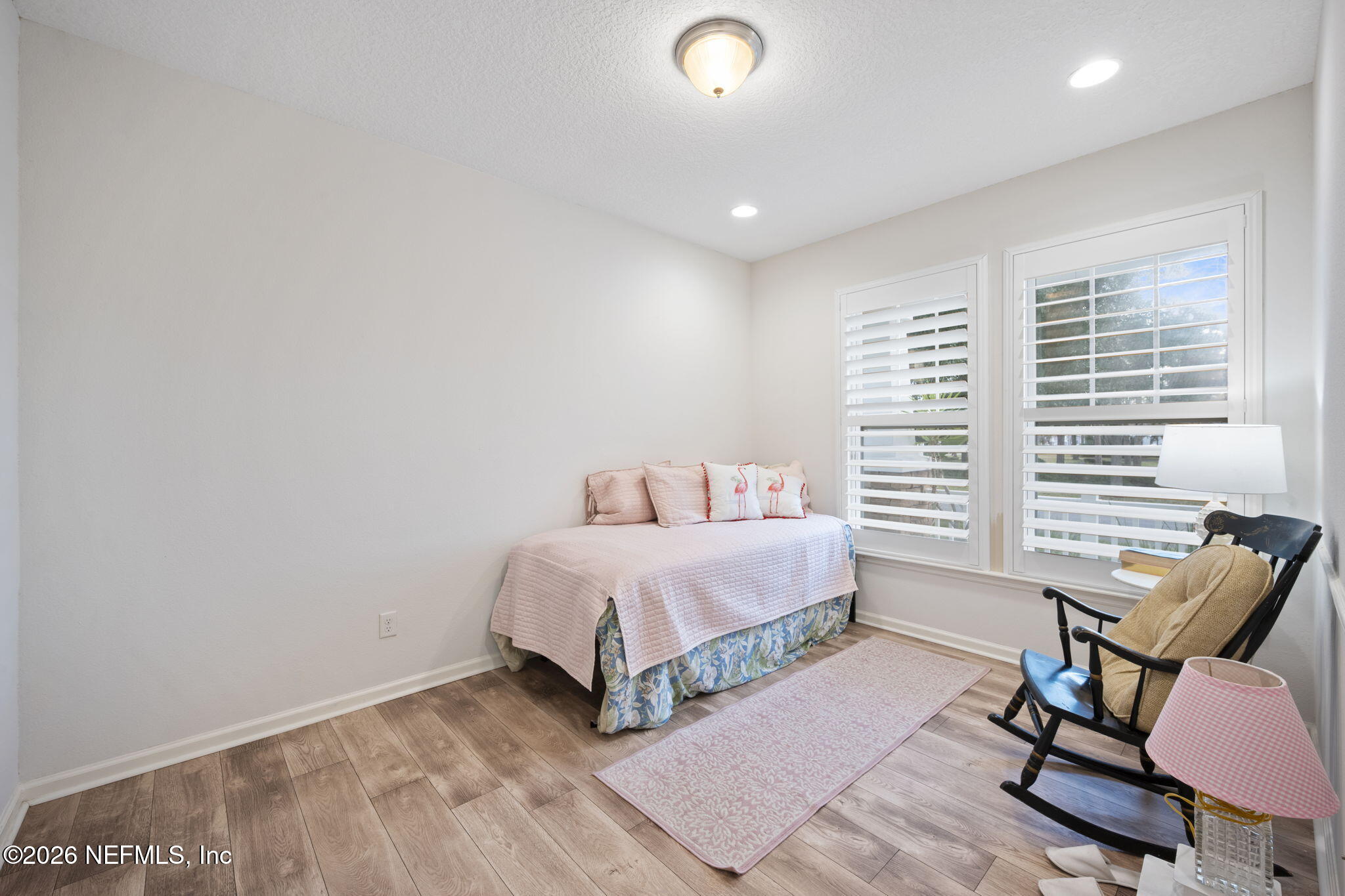 26 Olivette Street St. Johns, FL 32259 - Photo 23 of 42 a spacious bedroom with a bed and a chair