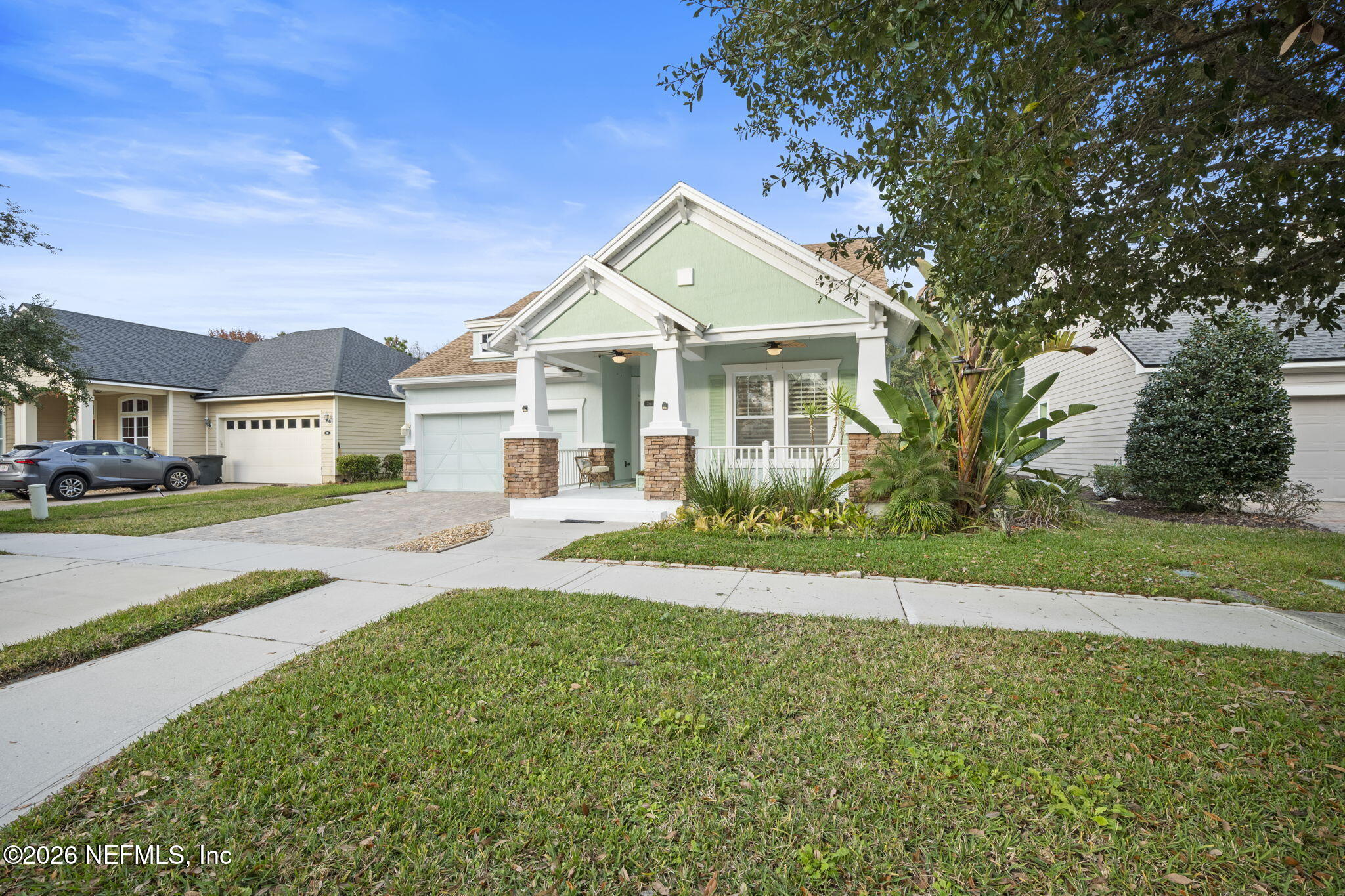26 Olivette Street St. Johns, FL 32259 - Photo 3 of 42 a front view of a house with a yard and garage