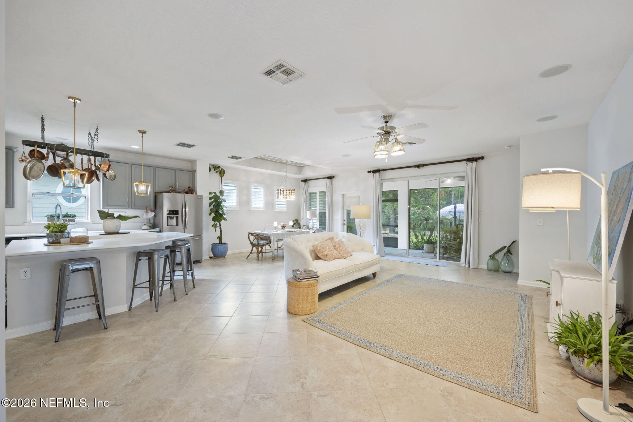 26 Olivette Street St. Johns, FL 32259 - Photo 5 of 42 a living room with furniture a chandelier and a dining table