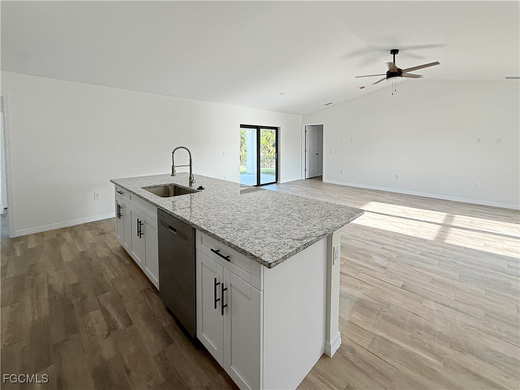 8157 Albatross Road Fort Myers, FL 33967 - Photo 8 of 24 a kitchen with a stove and a sink