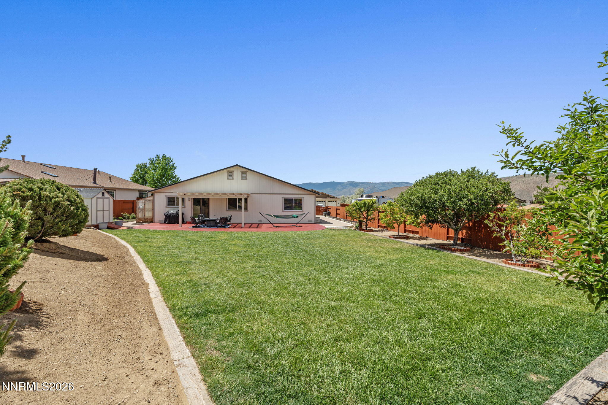 18324 Panda Bear Court Reno, NV 89508 - Photo 3 of 44 a front view of a house with a yard