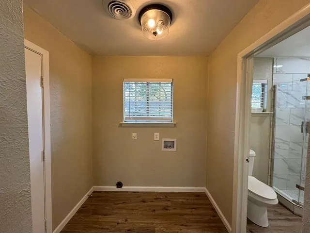 a view of room with window and hardwood floor