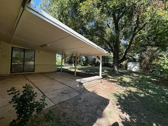a view of backyard with green space