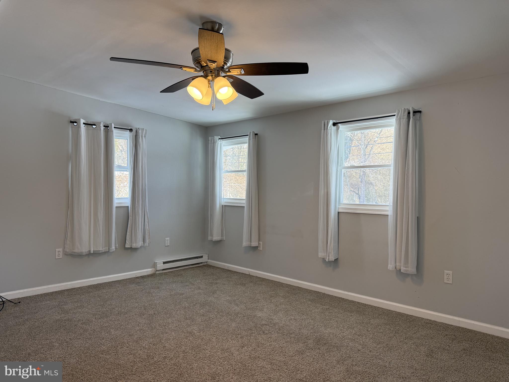 107 Anderson Road Newark, DE 19713 - Photo 4 of 11 an empty room with window and chandelier fan