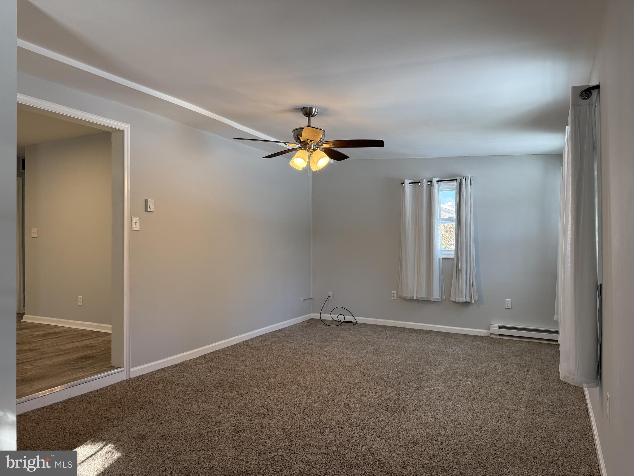 107 Anderson Road Newark, DE 19713 - Photo 5 of 11 wooden floor in an empty room with a window