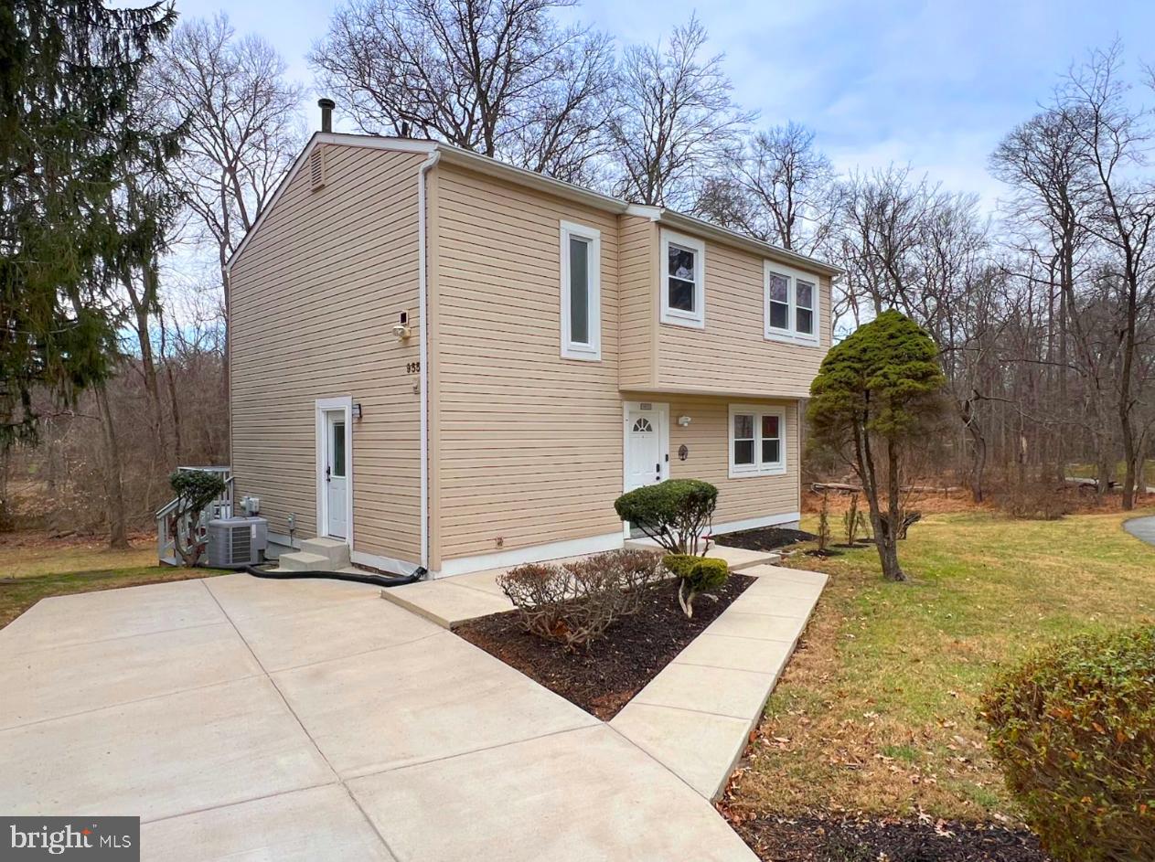 9551 Saddlebag Row Columbia, MD 21045 - Photo 1 of 30 a front view of house with yard outdoor seating and barbeque oven