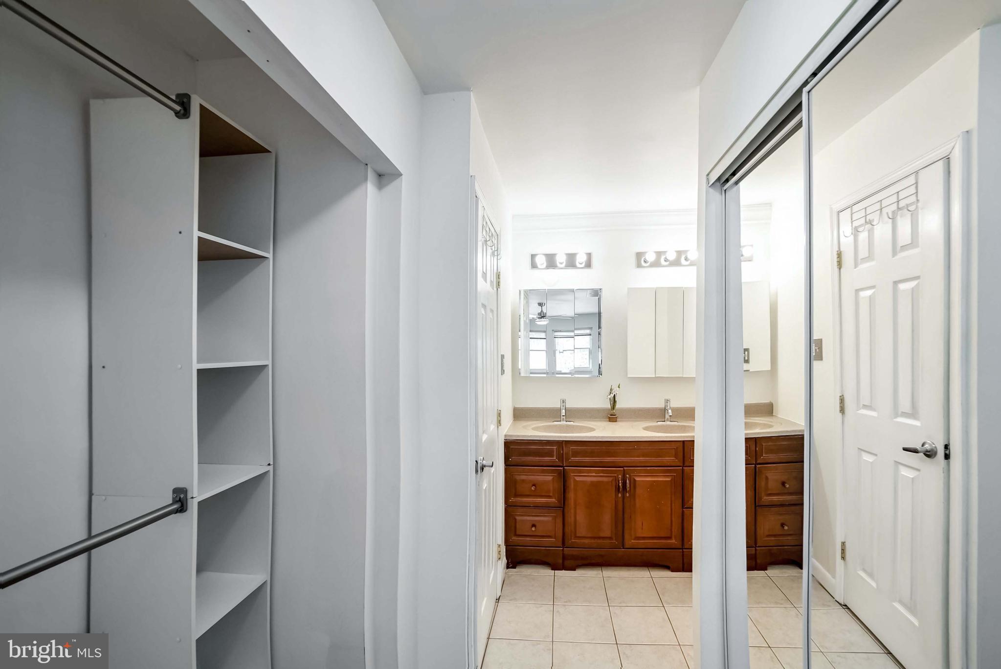 9551 Saddlebag Row Columbia, MD 21045 - Photo 19 of 30 a kitchen with stainless steel appliances granite countertop a refrigerator and a sink