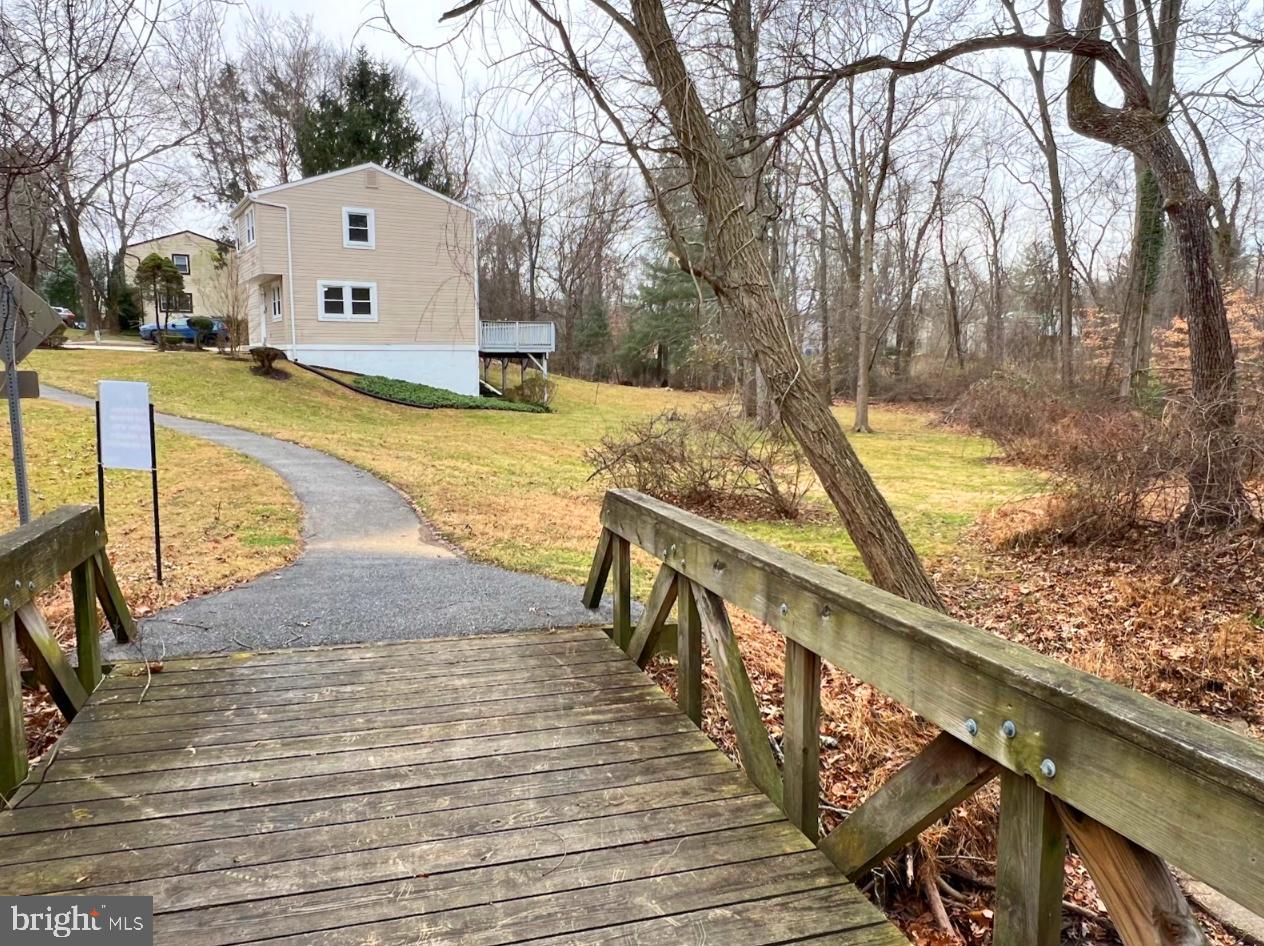 9551 Saddlebag Row Columbia, MD 21045 - Photo 2 of 30 a view of a house with large trees