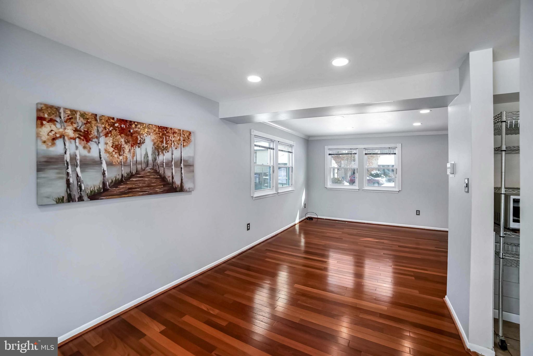 9551 Saddlebag Row Columbia, MD 21045 - Photo 6 of 30 a view of empty room with wooden floor