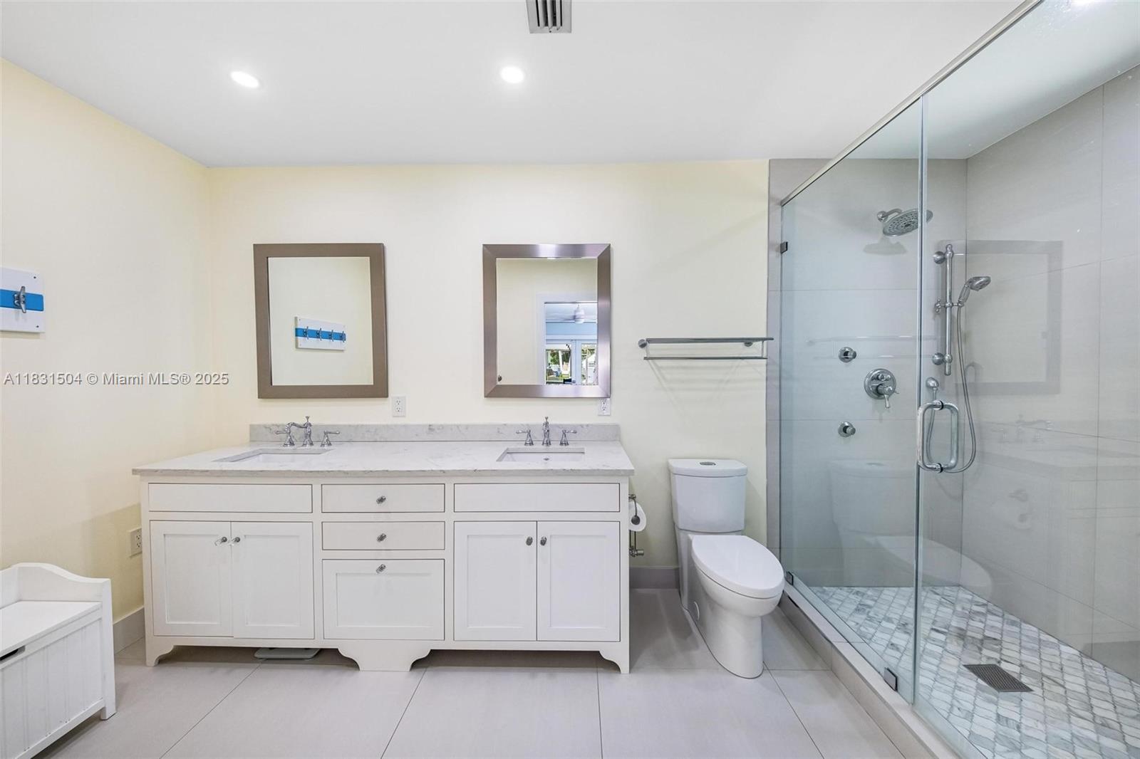 9720 Southwest 140th Street Miami, FL 33176 - Photo 12 of 24 a spacious bathroom with a double vanity sink toilet mirror and shower
