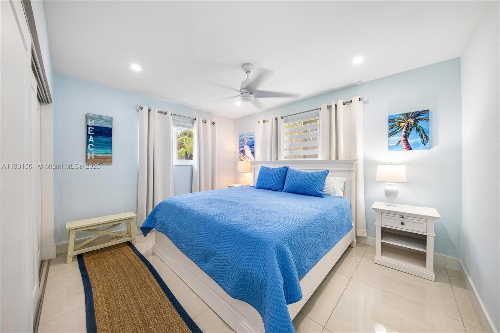 9720 Southwest 140th Street Miami, FL 33176 - Photo 13 of 24 a bedroom with a bed and a chandelier