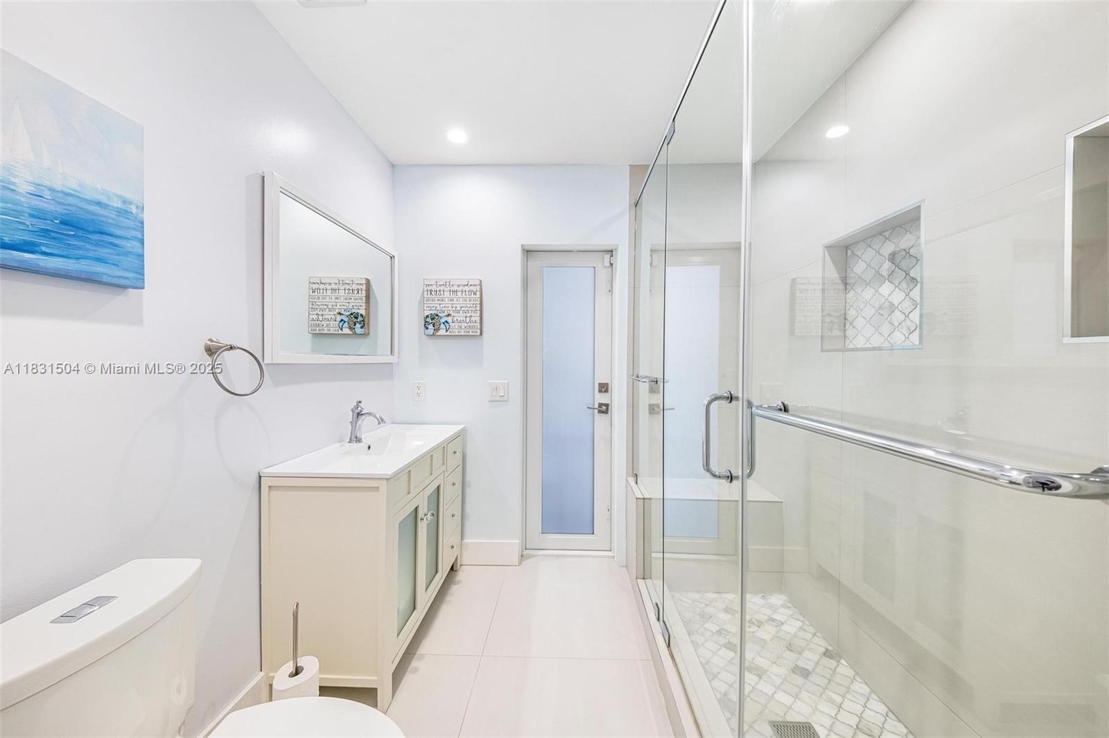 9720 Southwest 140th Street Miami, FL 33176 - Photo 17 of 24 a bathroom with a sink a toilet and shower