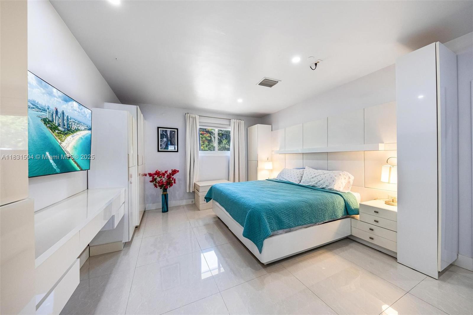 9720 Southwest 140th Street Miami, FL 33176 - Photo 18 of 24 a bedroom with a bed and a large window