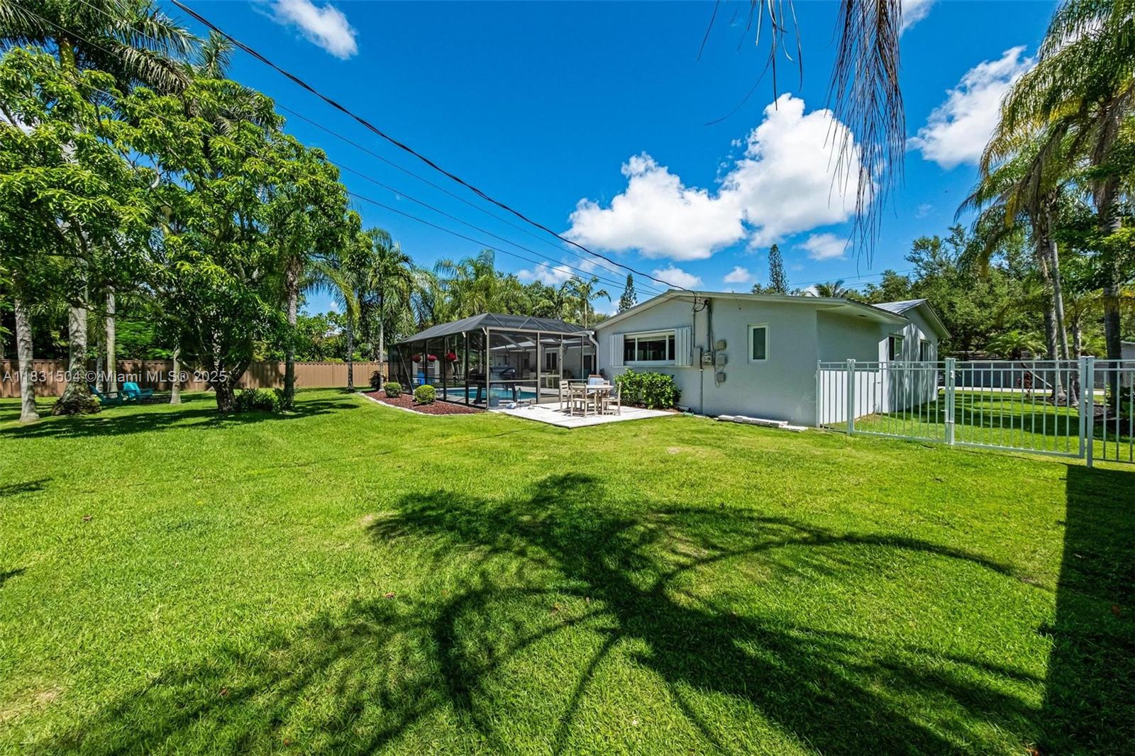 9720 Southwest 140th Street Miami, FL 33176 - Photo 23 of 24 a view of a house with a backyard