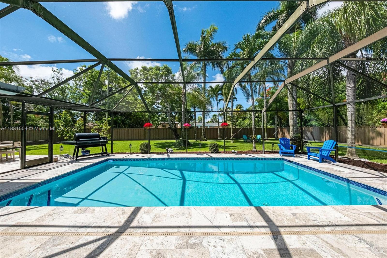 9720 Southwest 140th Street Miami, FL 33176 - Photo 3 of 24 a view of swimming pool with an outdoor seating