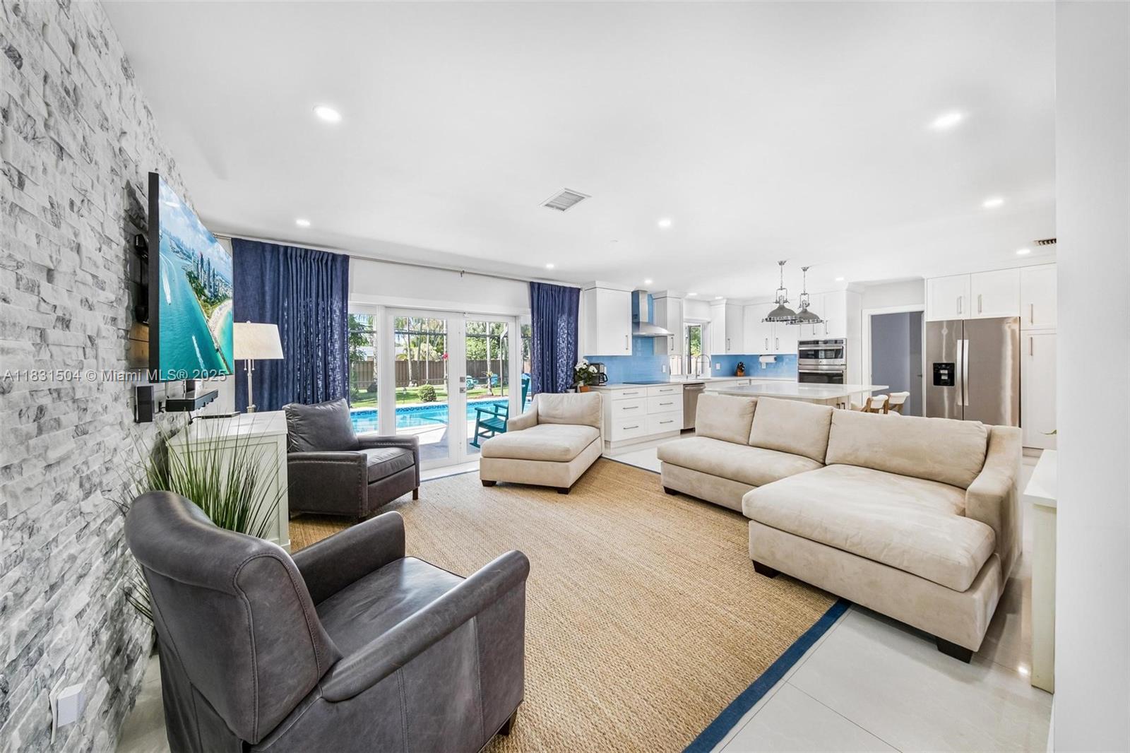 9720 Southwest 140th Street Miami, FL 33176 - Photo 6 of 24 a living room with furniture and a large window