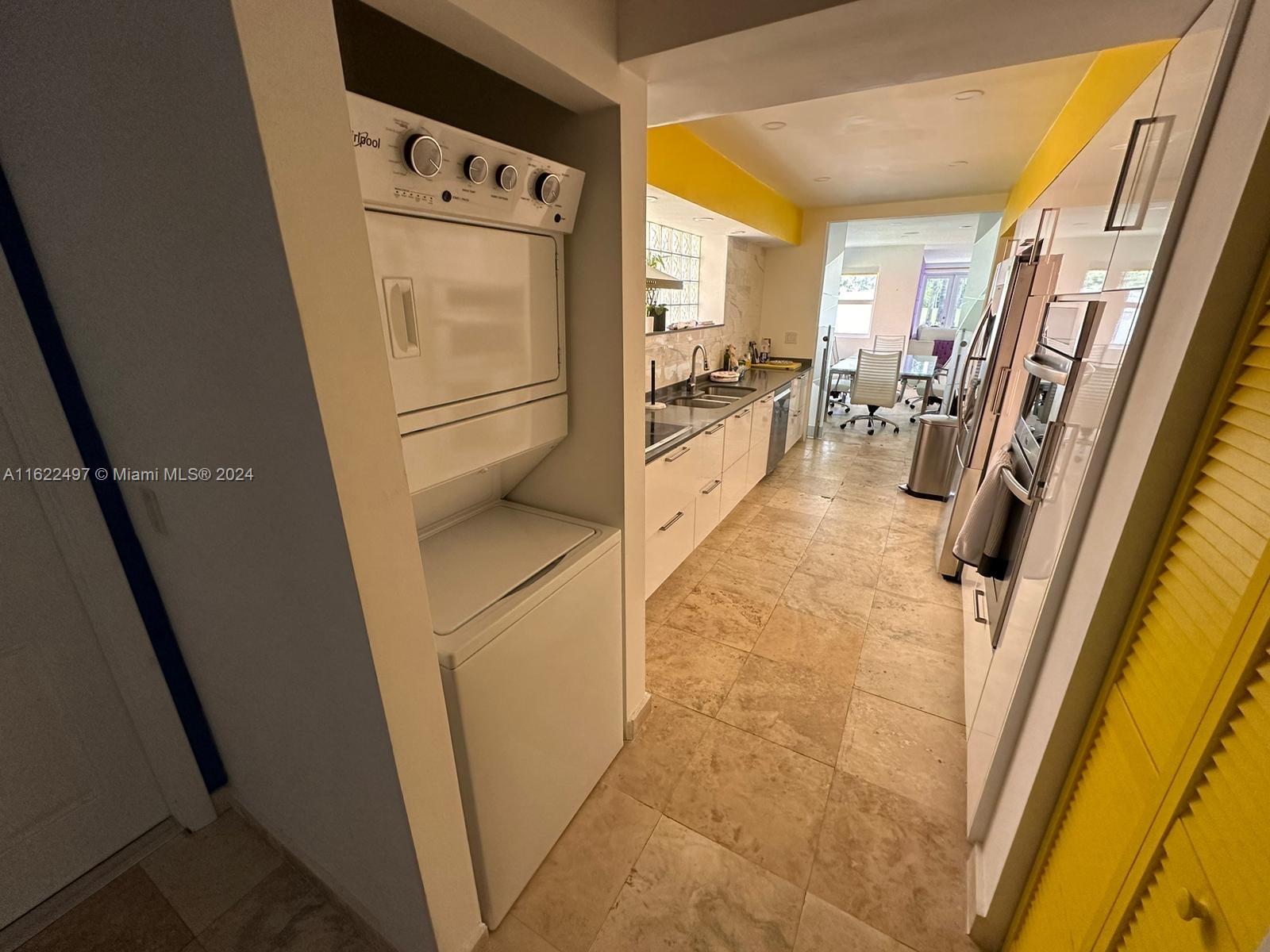 5301 Alton Road Miami Beach, FL 33140 - Photo 16 of 46 a view of a kitchen with furniture and refrigerator