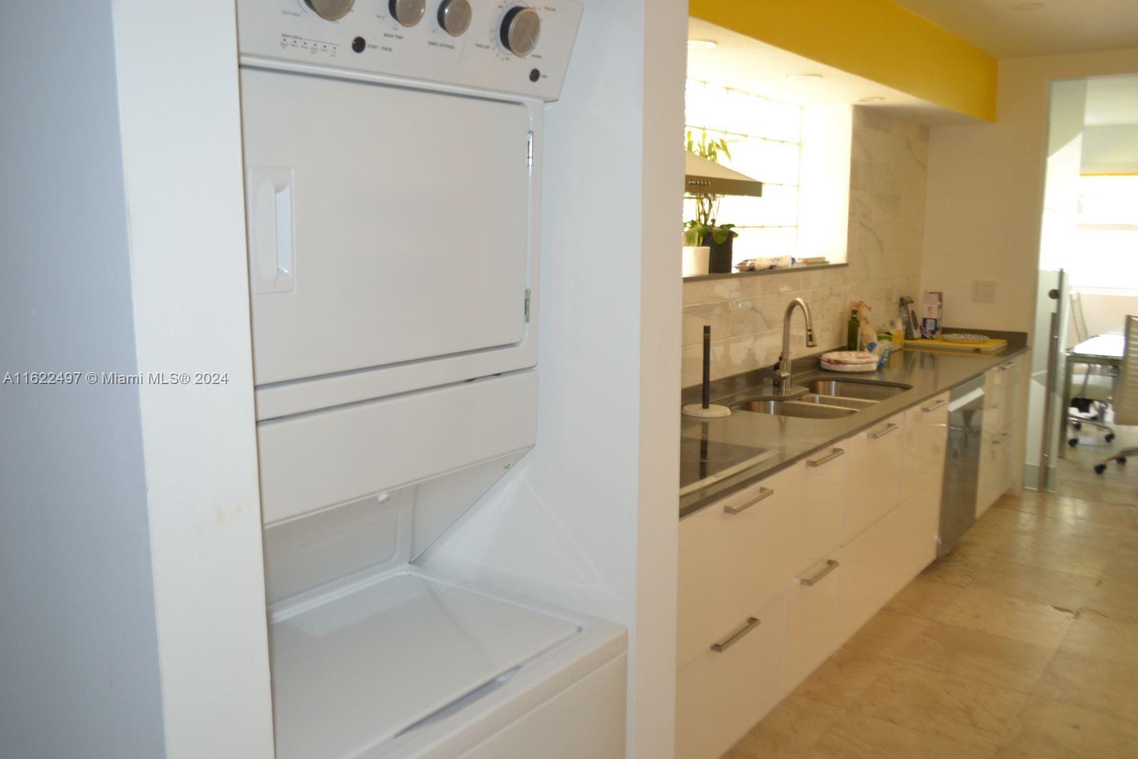 5301 Alton Road Miami Beach, FL 33140 - Photo 17 of 46 a bathroom with a sink and a mirror
