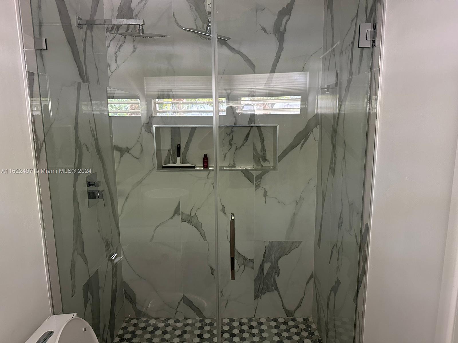 5301 Alton Road Miami Beach, FL 33140 - Photo 38 of 46 a bathroom with a shower