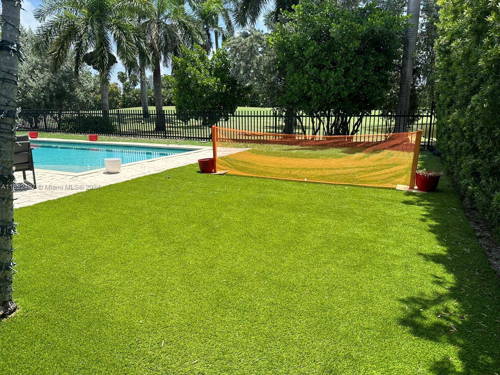 5301 Alton Road Miami Beach, FL 33140 - Photo 4 of 46 a view of a swimming pool with an outdoor space and seating area