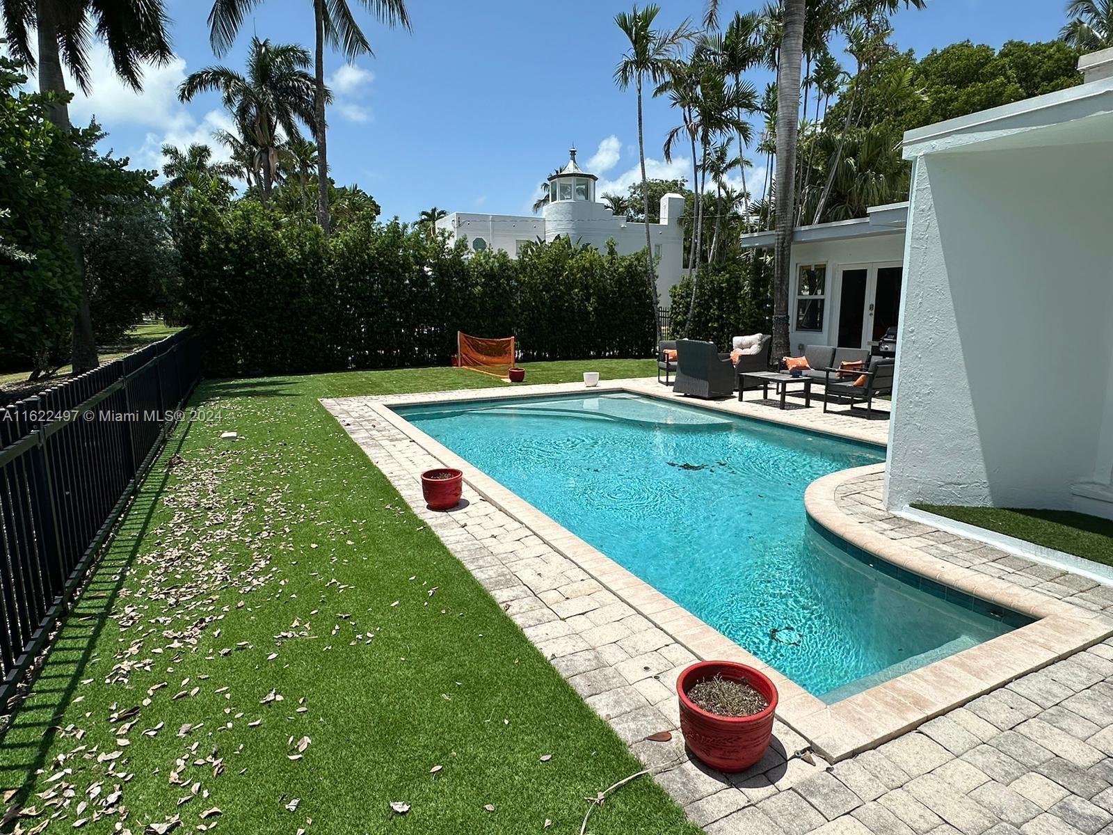 5301 Alton Road Miami Beach, FL 33140 - Photo 44 of 46 a view of swimming pool from a lounge chairs