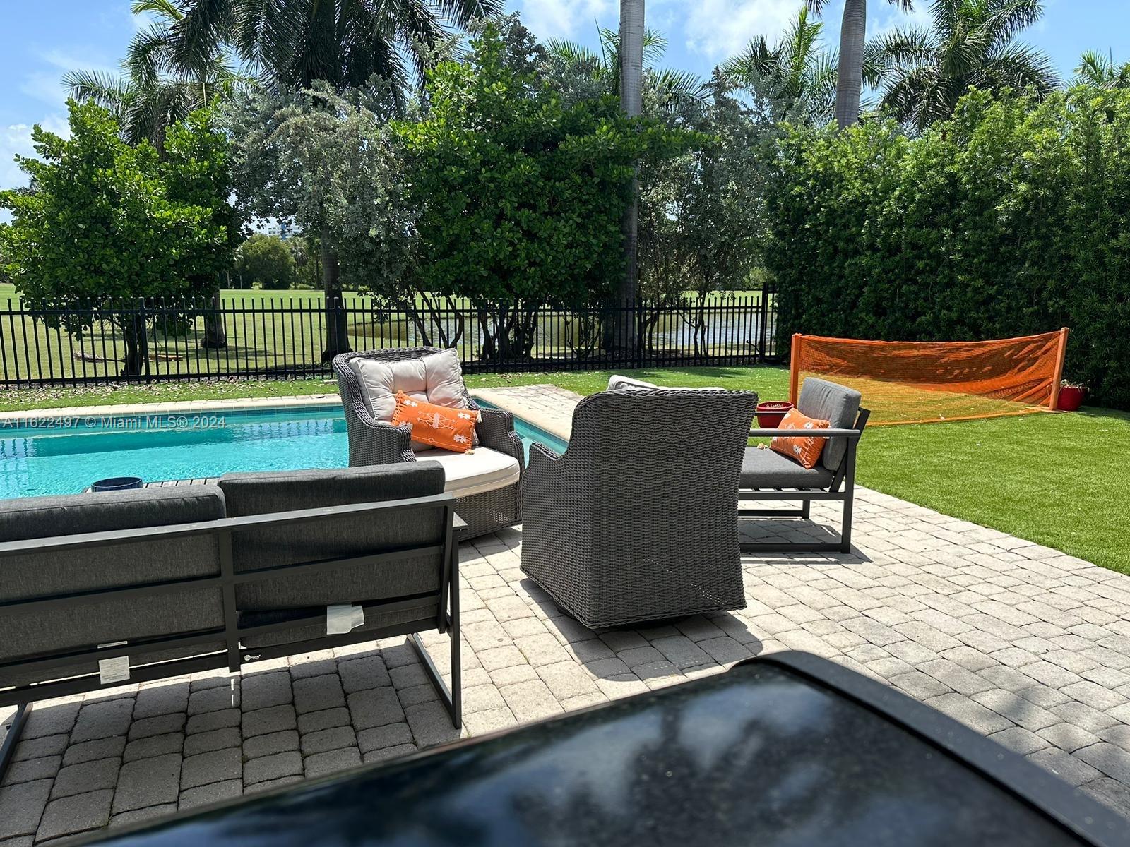 5301 Alton Road Miami Beach, FL 33140 - Photo 46 of 46 a backyard view of a sitting area with furniture