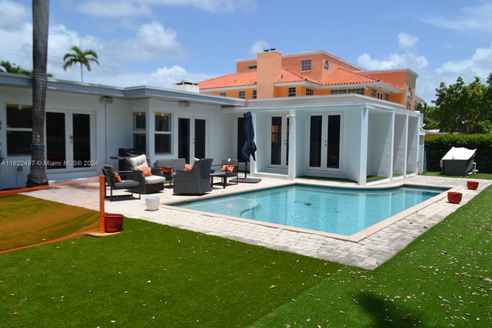 5301 Alton Road Miami Beach, FL 33140 - Photo 7 of 46 a view of a house with swimming pool and sitting area