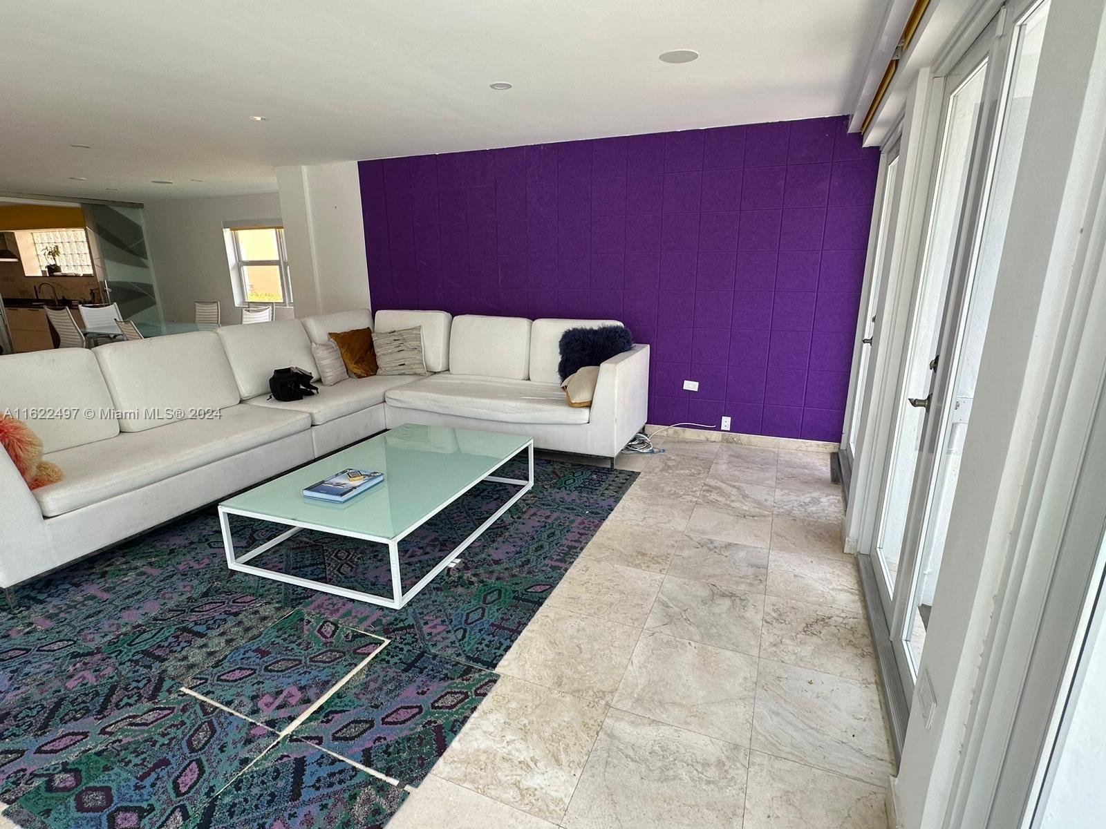 5301 Alton Road Miami Beach, FL 33140 - Photo 8 of 46 a living room with furniture and a rug