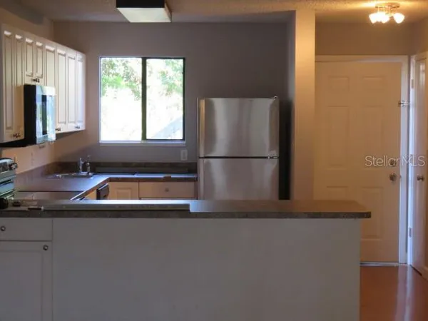 a bathroom with a sink a mirror and a bathtub