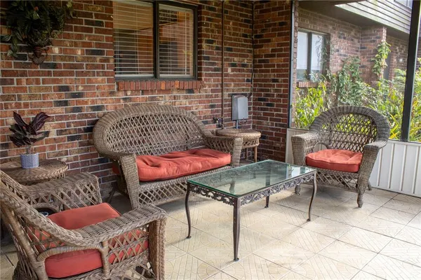 a balcony with table and chairs
