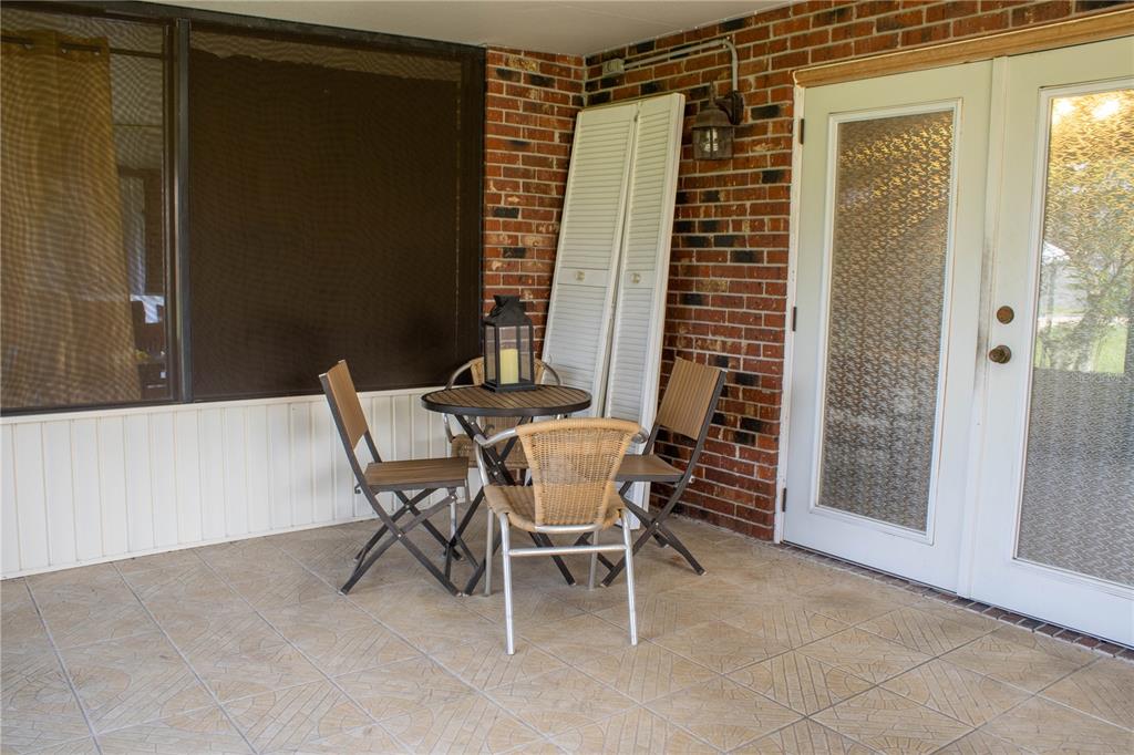 1836 North Crystal Lake Drive, Unit 95 Lakeland, FL 33801 - Photo 16 of 31 a dining room with furniture and window