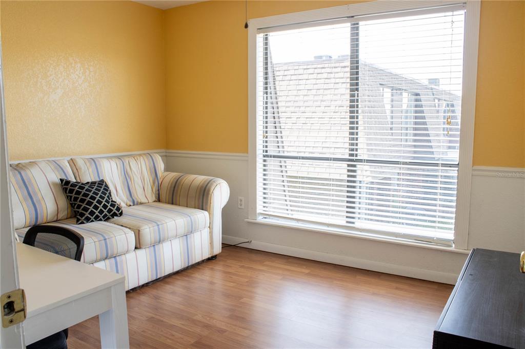1836 North Crystal Lake Drive, Unit 95 Lakeland, FL 33801 - Photo 22 of 31 a living room with furniture and a window