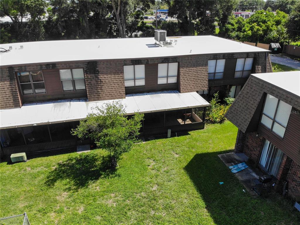 1836 North Crystal Lake Drive, Unit 95 Lakeland, FL 33801 - Photo 25 of 31 a view of a house with backyard and sitting area