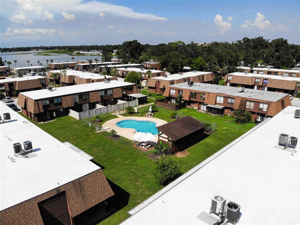 1836 North Crystal Lake Drive, Unit 95 Lakeland, FL 33801 - Photo 26 of 31 a view of a swimming pool and outdoor seating