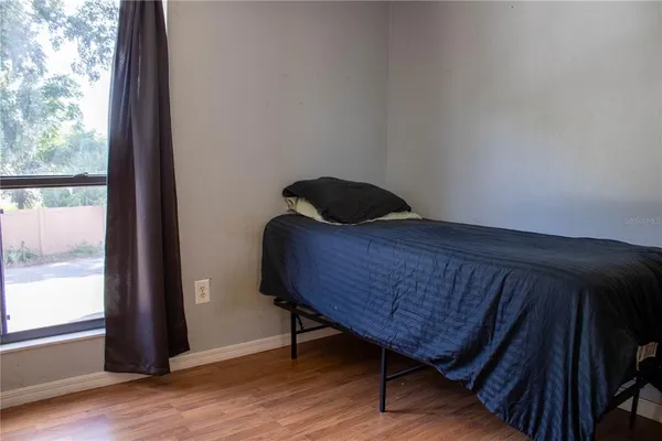 an aerial view of a house with a garden and lake view