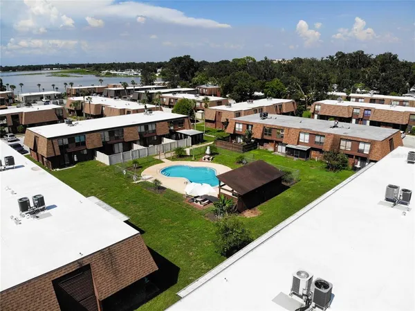 an aerial view of residential houses with outdoor space