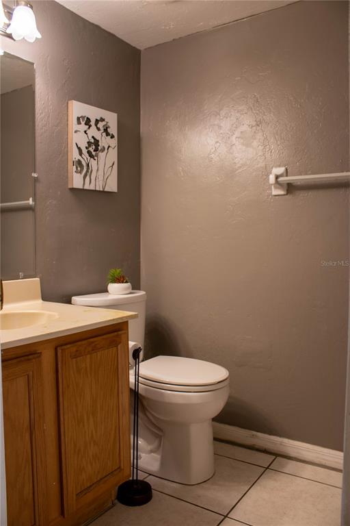 1836 North Crystal Lake Drive, Unit 95 Lakeland, FL 33801 - Photo 3 of 31 a bathroom with a toilet and a sink