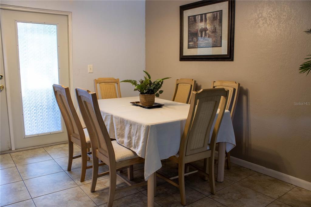 1836 North Crystal Lake Drive, Unit 95 Lakeland, FL 33801 - Photo 6 of 31 a view of a dining room with furniture