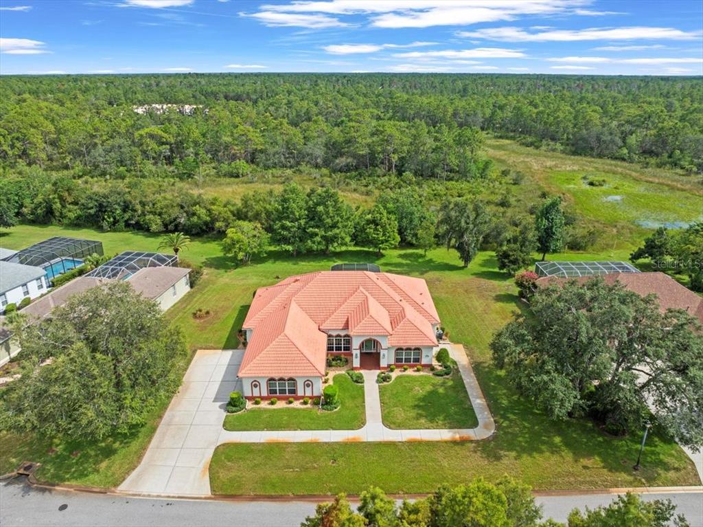 8698 Mississippi Run Weeki Wachee, FL 34613 - Photo 1 of 58 an aerial view of a house