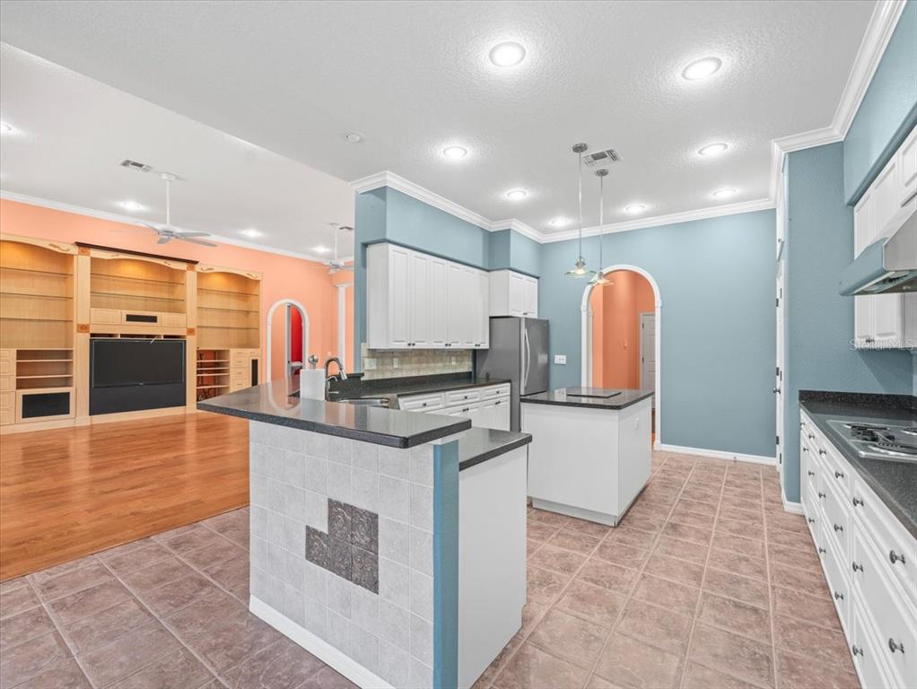 8698 Mississippi Run Weeki Wachee, FL 34613 - Photo 18 of 58 a kitchen with stainless steel appliances granite countertop a stove and a sink
