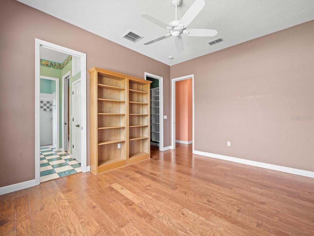 8698 Mississippi Run Weeki Wachee, FL 34613 - Photo 38 of 58 a view of wooden floor and windows in a room