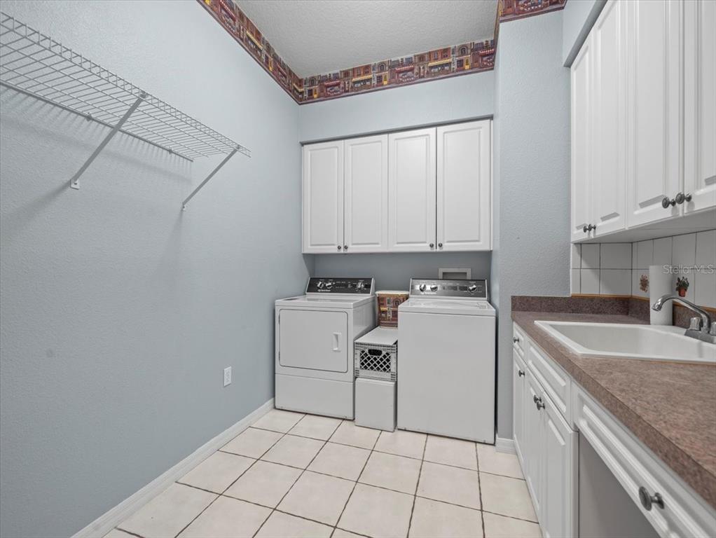 8698 Mississippi Run Weeki Wachee, FL 34613 - Photo 42 of 58 a view of a kitchen with sink and washing machine