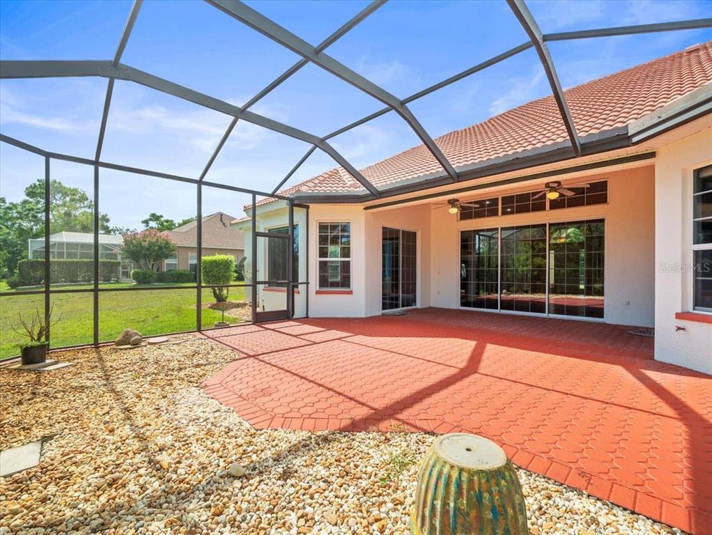 8698 Mississippi Run Weeki Wachee, FL 34613 - Photo 49 of 58 a view of a house with a backyard