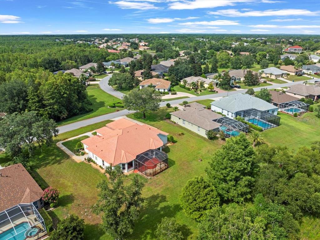 8698 Mississippi Run Weeki Wachee, FL 34613 - Photo 54 of 58 an aerial view of residential houses with outdoor space and trees