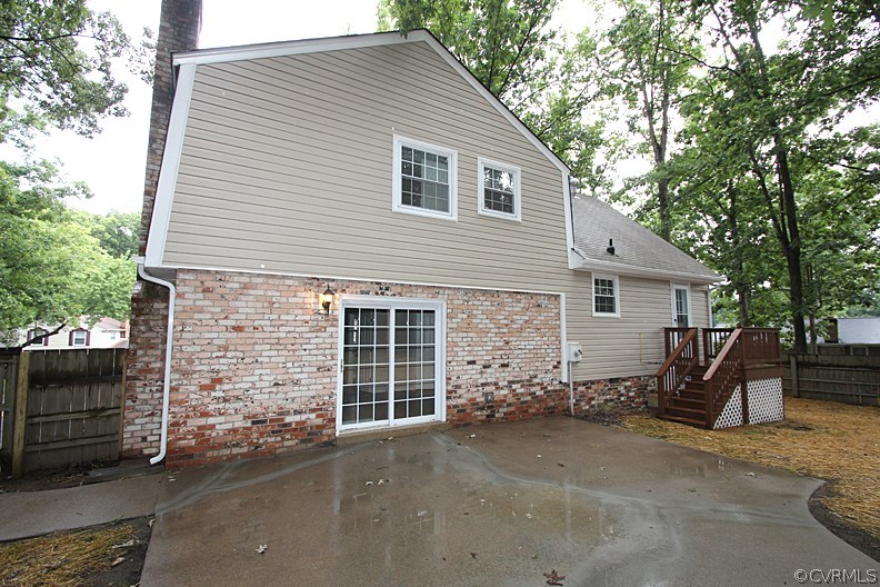 12010 West Petty Road Midlothian, VA 23113 - Photo 17 of 20 a view of a house with a yard and wooden fence